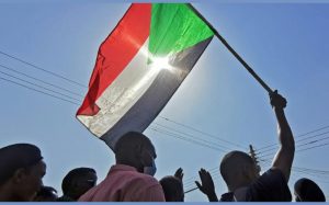 Le drapeau soudanais lors d'une manifestation contre le coup d'Etat militaire, le 13 janvier 2022 à Khartoum afp.com - -